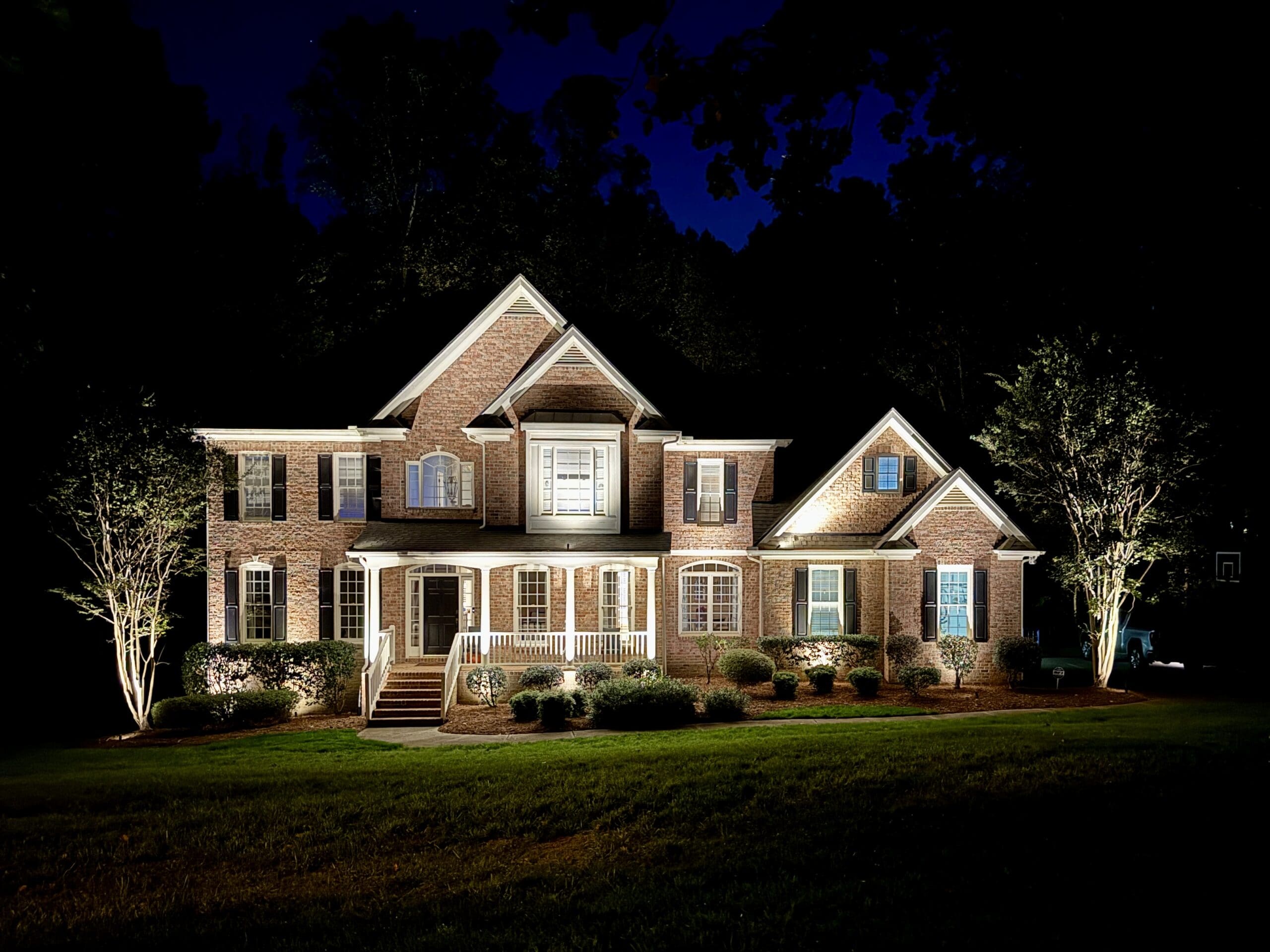 home with outdoor landscape lighting