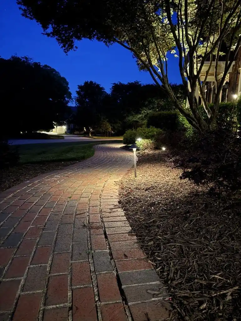 landscape lighting on a brick path in Raleigh, NC.