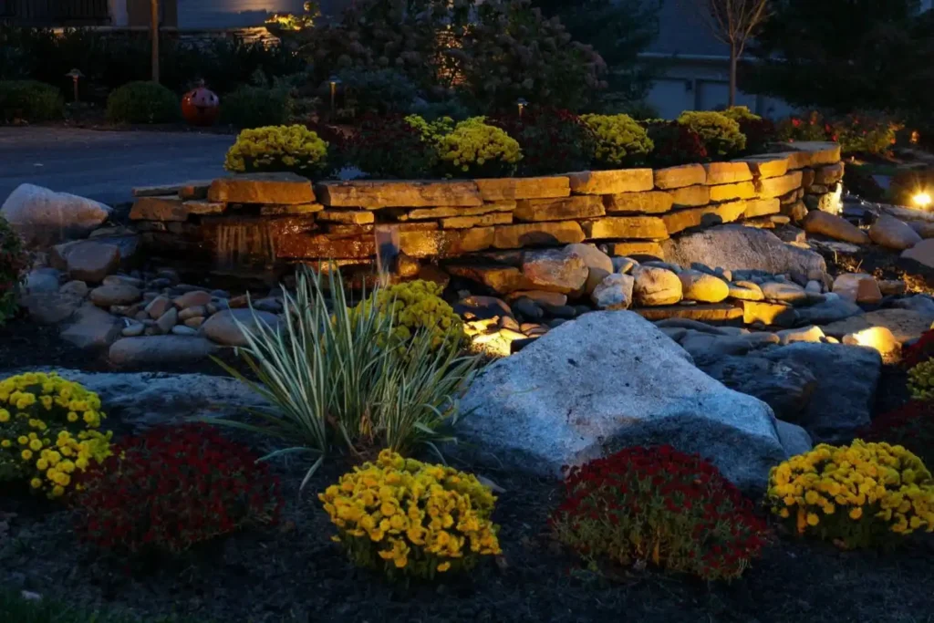 Landscape illuminated by way of flood lighting.