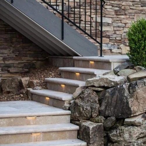 Stairs light up as a result of outdoor lighting repair in the Raleigh area.